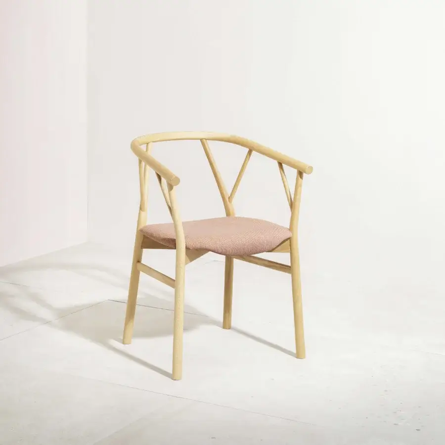 Superior Miniforms Valerie armchair with light-toned wood and pinkish upholstery offers a curved silhouette