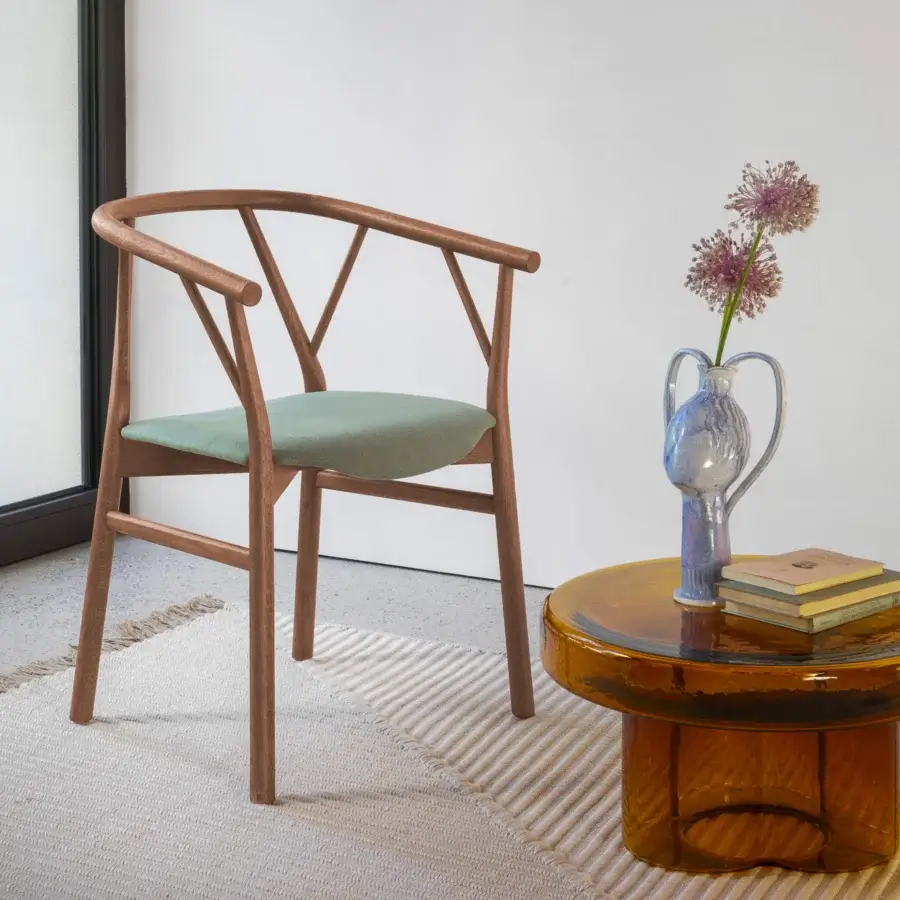Distinguished Miniforms Valerie armchair with muted green cushioned seat and smooth medium-toned wooden frame