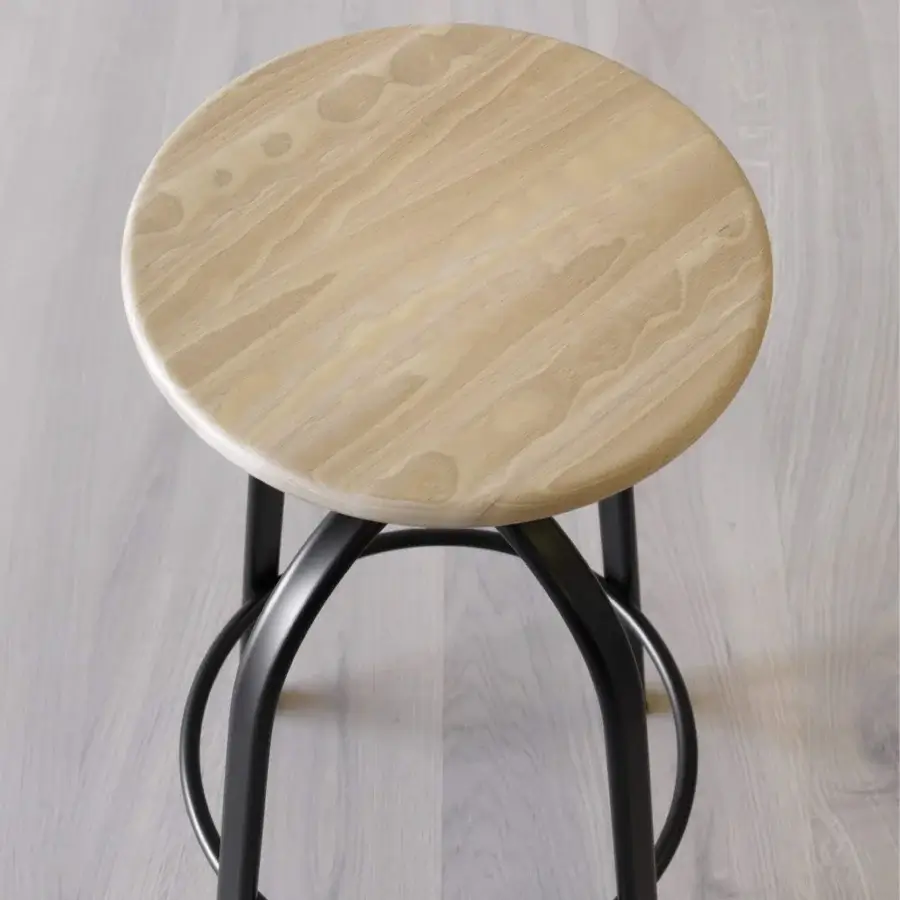 Superior Miniforms Ferrovitos stool with light-colored wooden seat and sleek black curving metal base