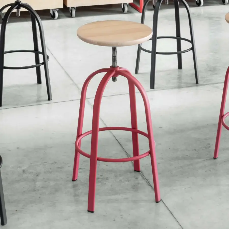 Elegant Miniforms Ferrovitos stool with a light-colored wooden seat and vibrant red metal base