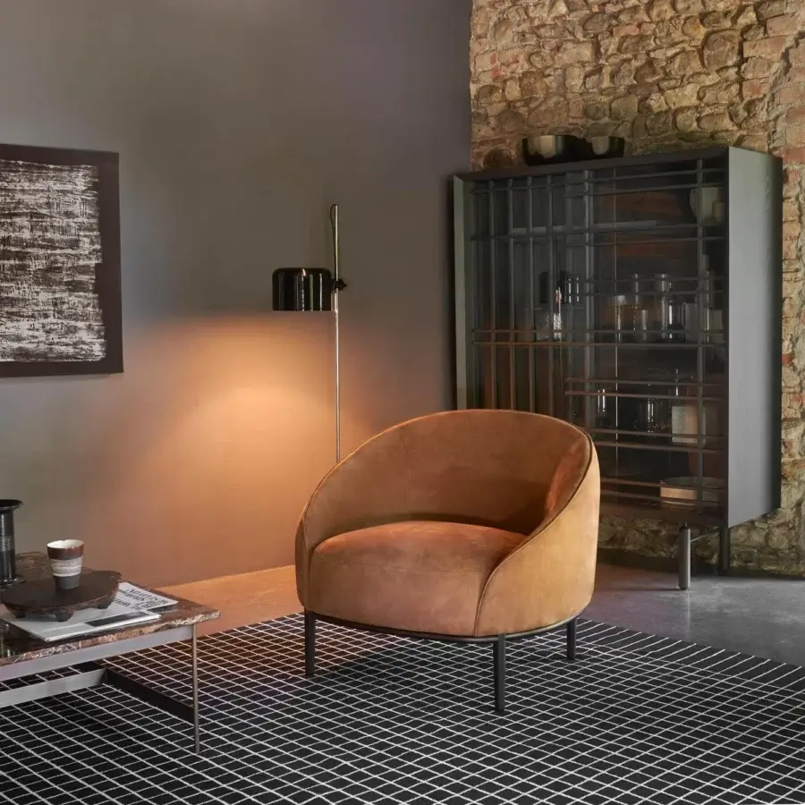 Stylish Potocco Yoisho lounge chair with sinuous lines upholstered in warm brown textile and ash legs with burnished brass detail