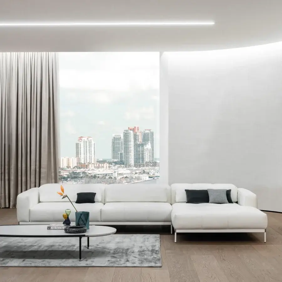 Lavish Cierre1972 Oscar sectional with white material upholstery, chromed metal base and siliconized microfiber cushions