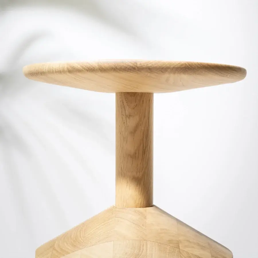 Distinguished Miniforms Pezzo stool crafted from solid oak with a smooth natural wood tone and matte finish