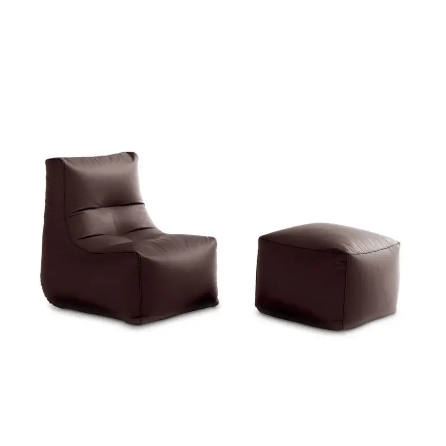 Elegant Casamania Morfino lounge chair and ottoman in dark brown leatherette with a geometric silhouette