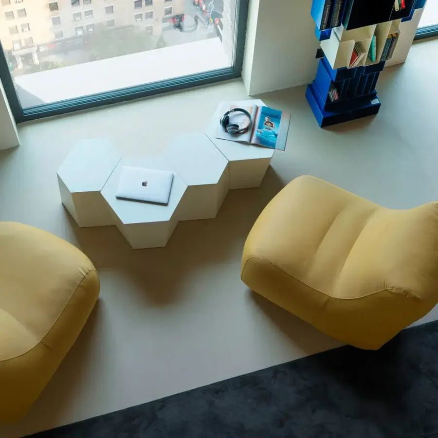 Exceptional Casamania Morfino lounge chair with enveloping form and muted yellow leatherette upholstery, exhibiting a textured matte finish