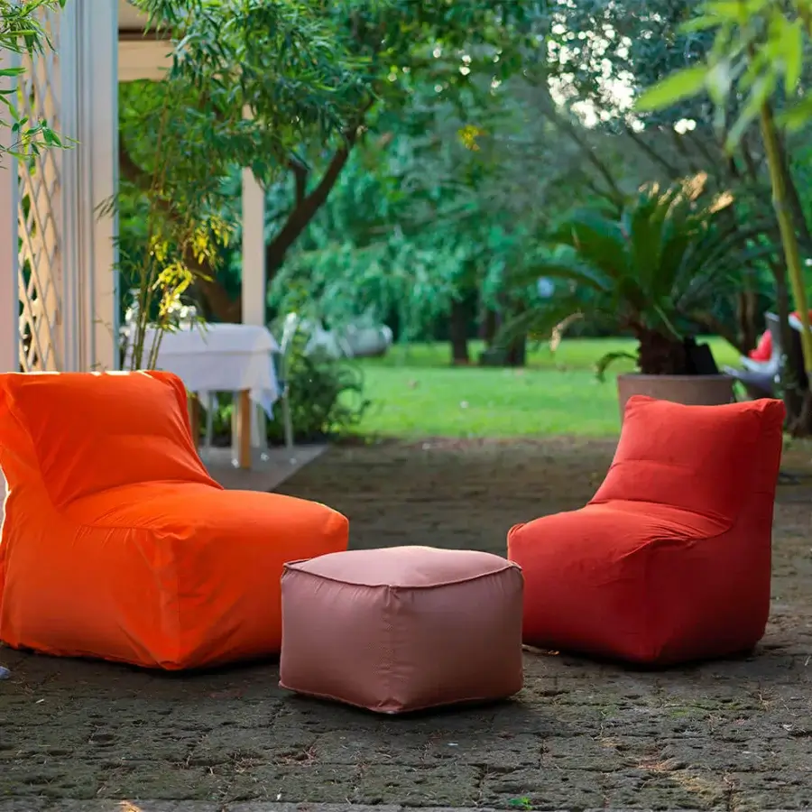 Captivating Casamania Morfino lounge chair with a wide profile and orange leatherette upholstery