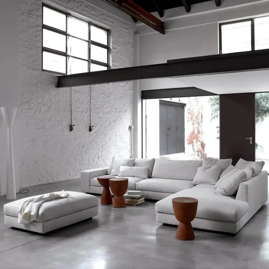 Superior Verzelloni Holden sectional upholstered in light gray woven textile with black-stained beech feet