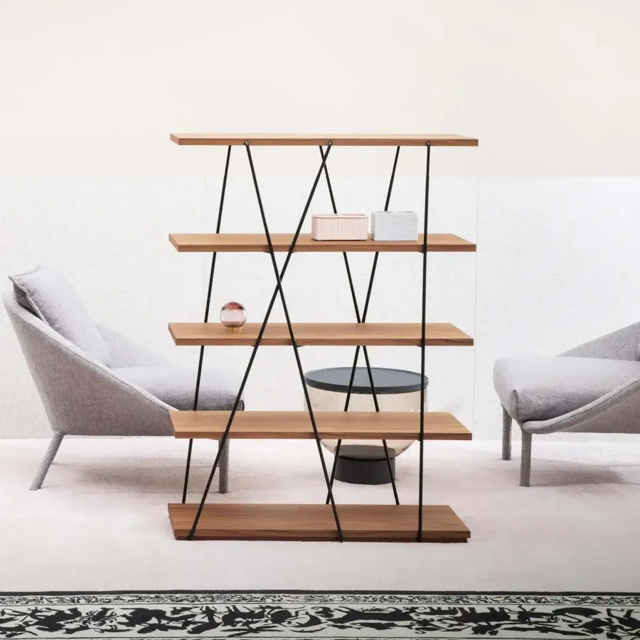 Elegant Miniforms Matassa bookcase with black metal lines wrapping warm brown wooden shelves in a matte finish