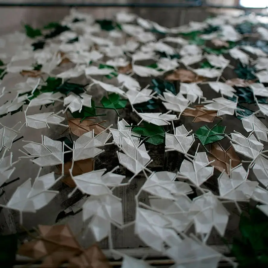 Exceptional Casamania Maria Leaf screen with stylized leaves in white, green, and brown tones crafted from a mesh synthetic material
