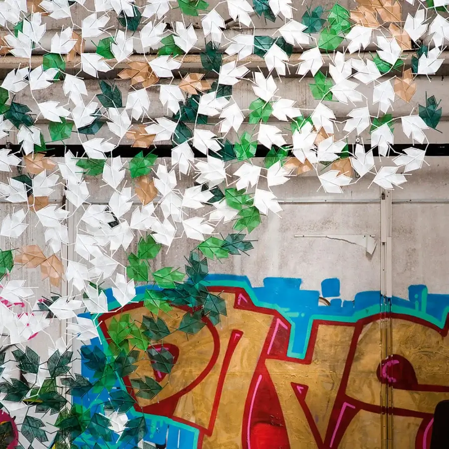Innovative Casamania Maria Leaf screen with delicate leaf replication in white, green, and translucent brown synthetic material and smooth finish