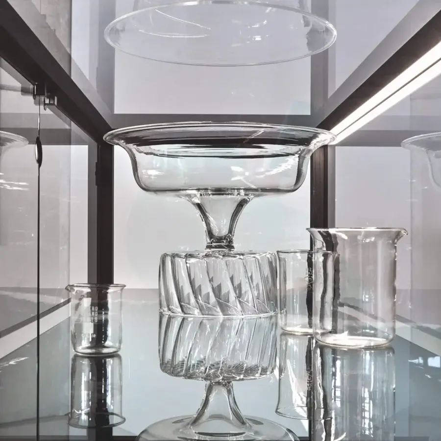 Distinguished Miniforms Juno Bar Cabinet with clear glass panels in a dark-toned frame, lit from within and made in Italy