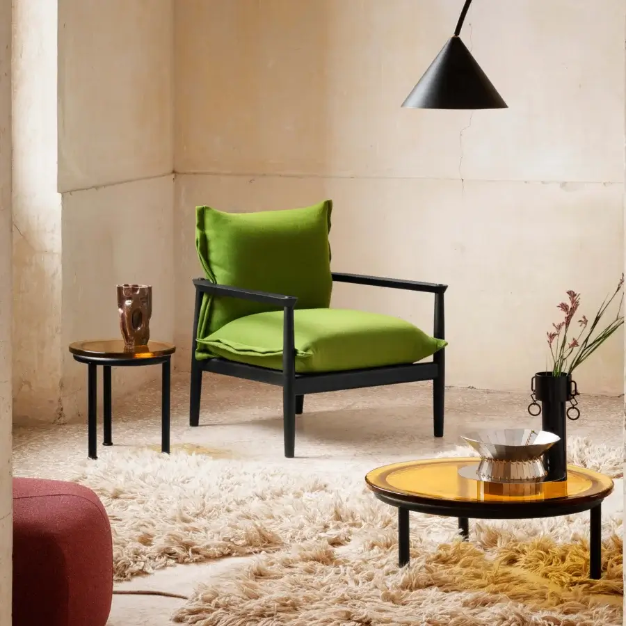 Distinguished Miniforms Sergia lounge chair with a black wood frame and plush green textile cushions showcasing contemporary style