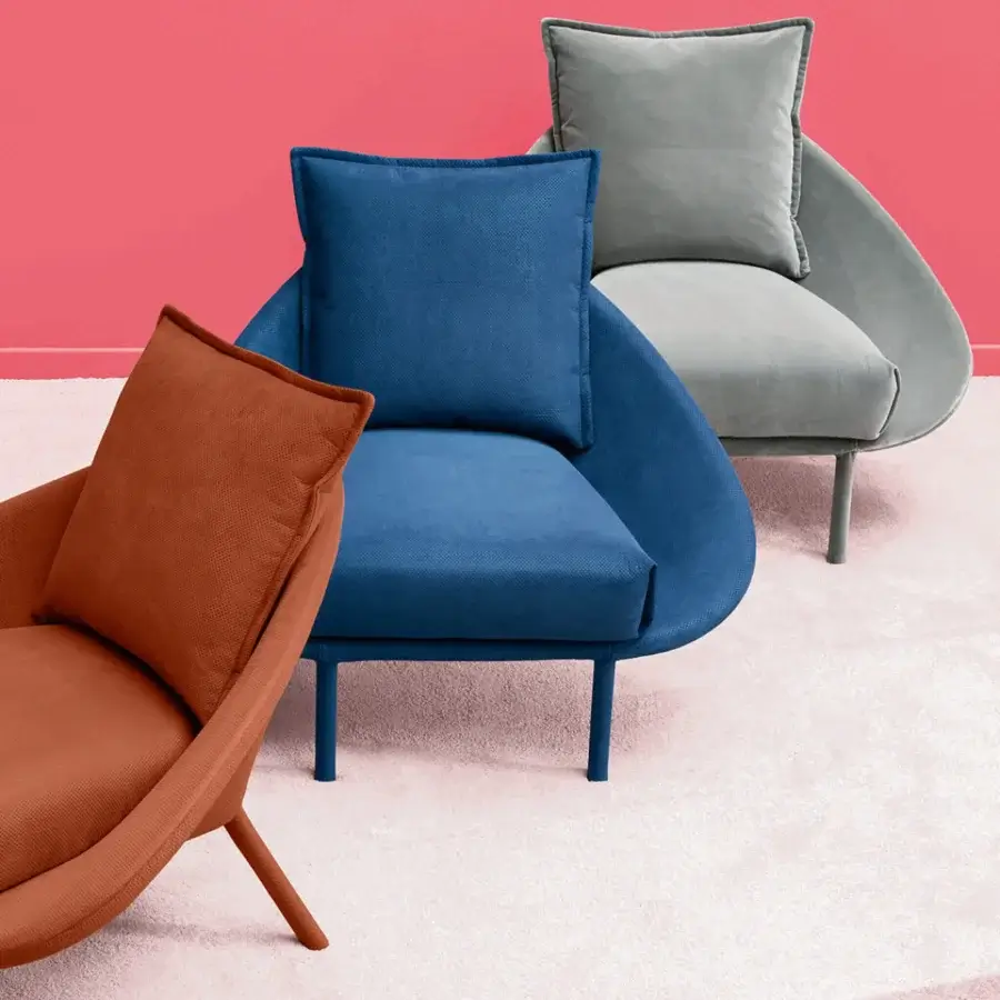 Distinguished Miniforms Lem lounge chair with curved silhouette and orange-brown textile upholstery with color-matched metal legs