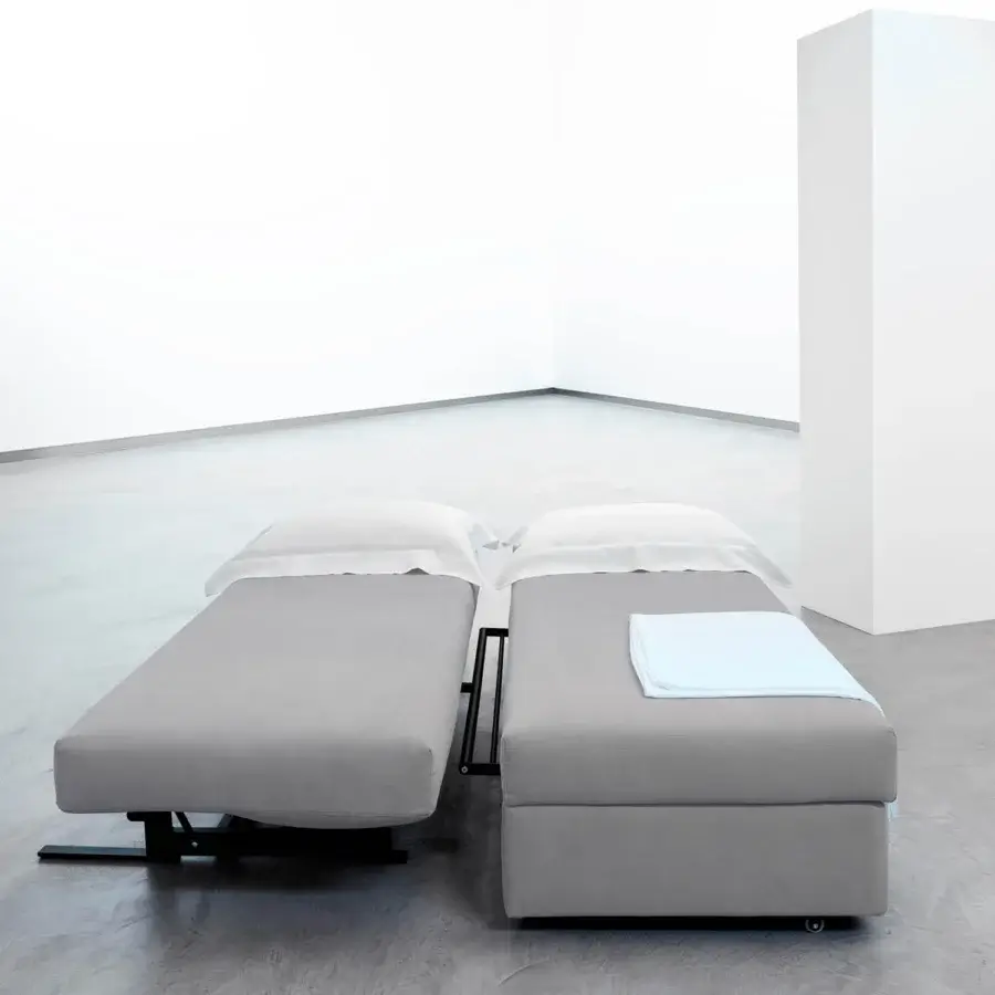 Superior Horm Vulcano sofabed with smooth matte gray textile upholstery and balanced opening mechanism for versatile bed configurations