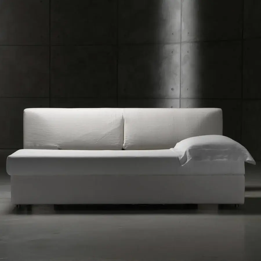 Elegant Horm Vulcano sofabed with minimalist white textile upholstery and a balanced opening for versatile bed configurations