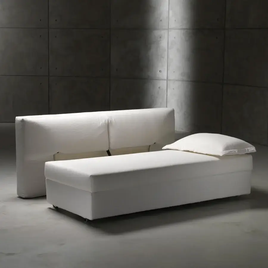 Distinguished Horm Vulcano sofabed with removable white fabric upholstery and a balanced opening mechanism for versatile bed settings