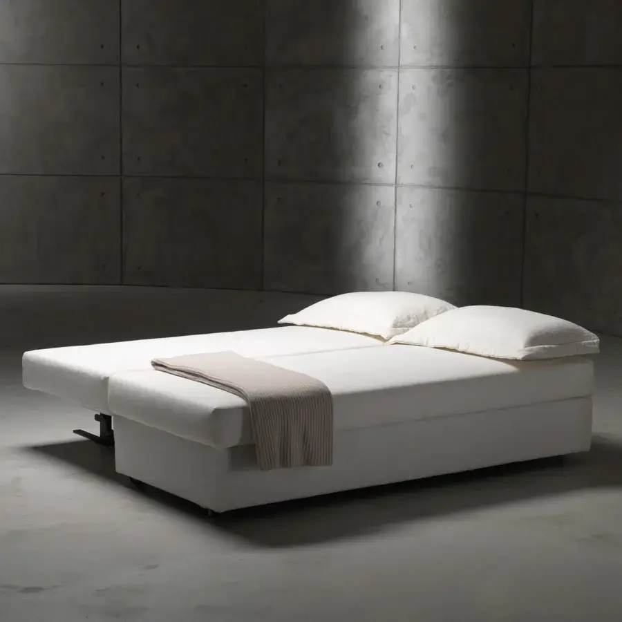 Exceptional Horm Vulcano sofabed with white removable fabric upholstery and a balanced transforming mechanism