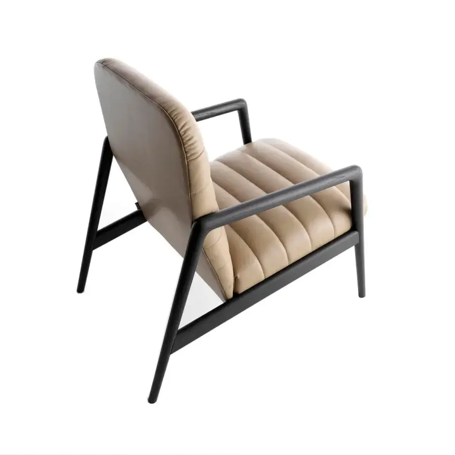 Superior Horm Carnaby lounge chair with light tan upholstery and a matte dark-colored wood frame built in Italy