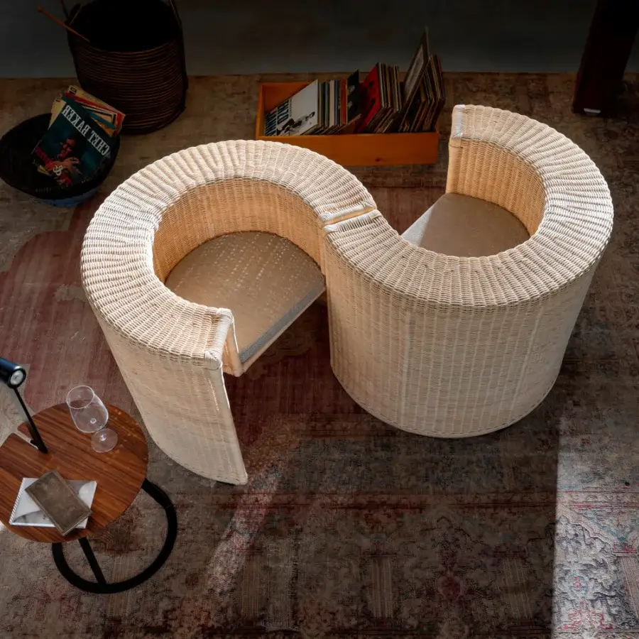 Architectural Horm Charlotte lounge chair with light beige handwoven natural wicker and uniquely rounded, clean lines
