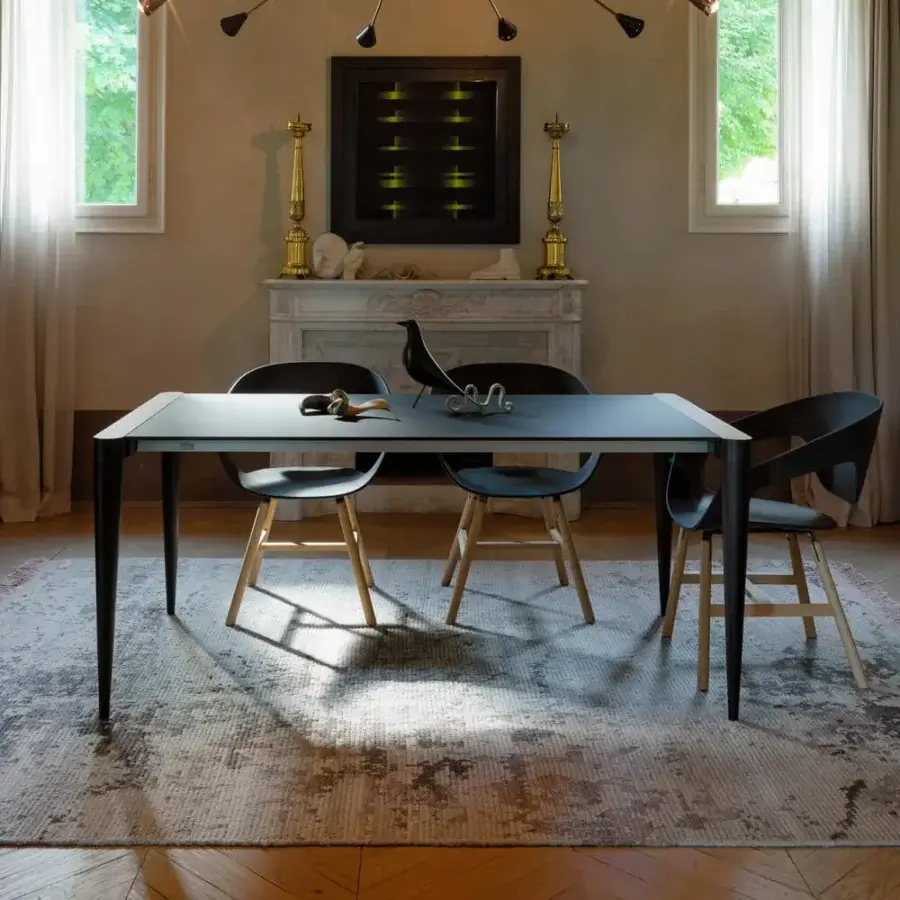 Exceptional Horm Bolero table with dark gray Fenix tabletop and handcrafted Canaletto walnut details offering lasting style