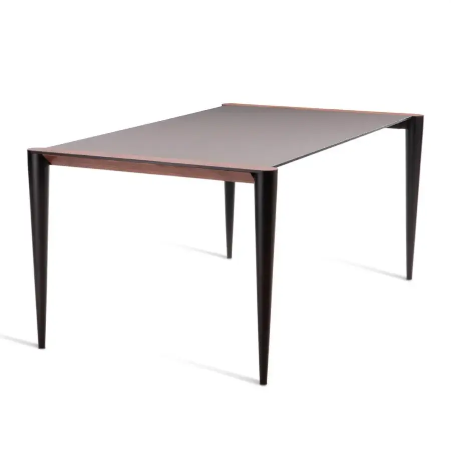 Exceptional Horm Bolero table with dark brown Fenix top and slender Canaletto walnut legs crafted with hand-applied details