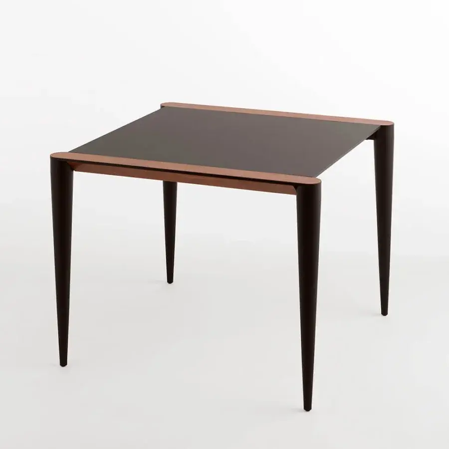 Distinguished Horm Bolero Bistrot table with dark matte tabletop and Canaletto walnut detailing crafted in Italy