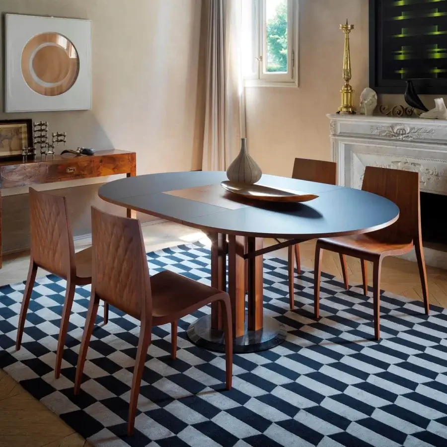 Exceptional Horm Flower extendable table with dark Fenix tabletop and warm brown Canaletto walnut panel crafted with a dark marble base