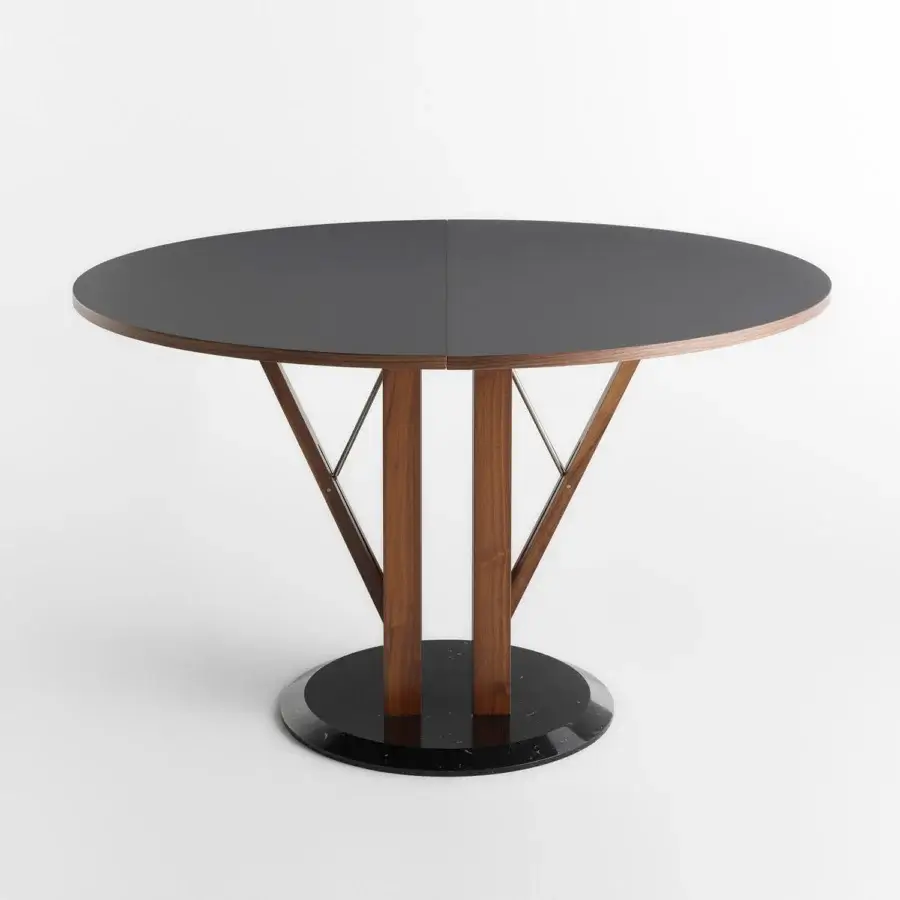 Superior Horm Flower extendable table with dark matte Fenix tabletop and Canaletto walnut legs built upon a marble base