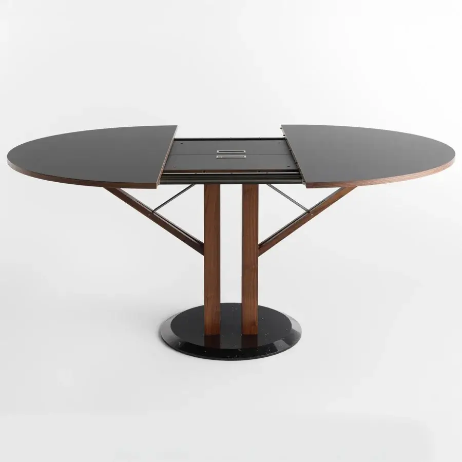 Innovative Horm Flower extendable table with matte black Fenix tabletop and Canaletto walnut legs built with a black marble base