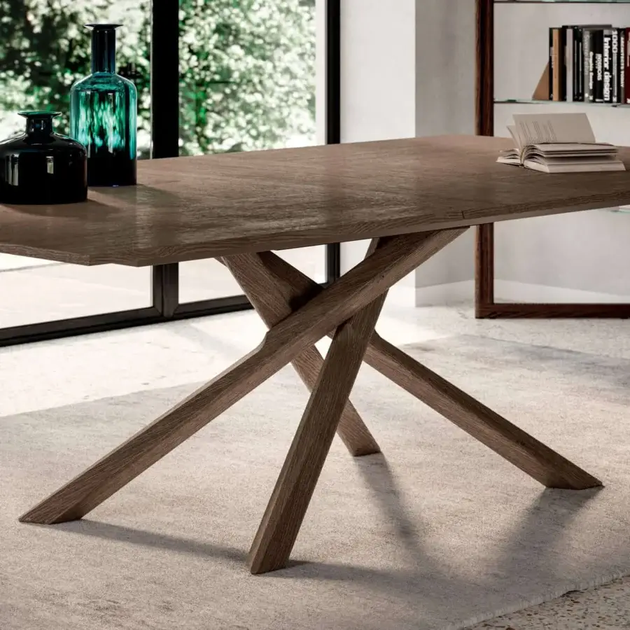 Superior Ozzio Italia Arizona extendable table with warm brown wood and a uniquely designed intersecting leg base