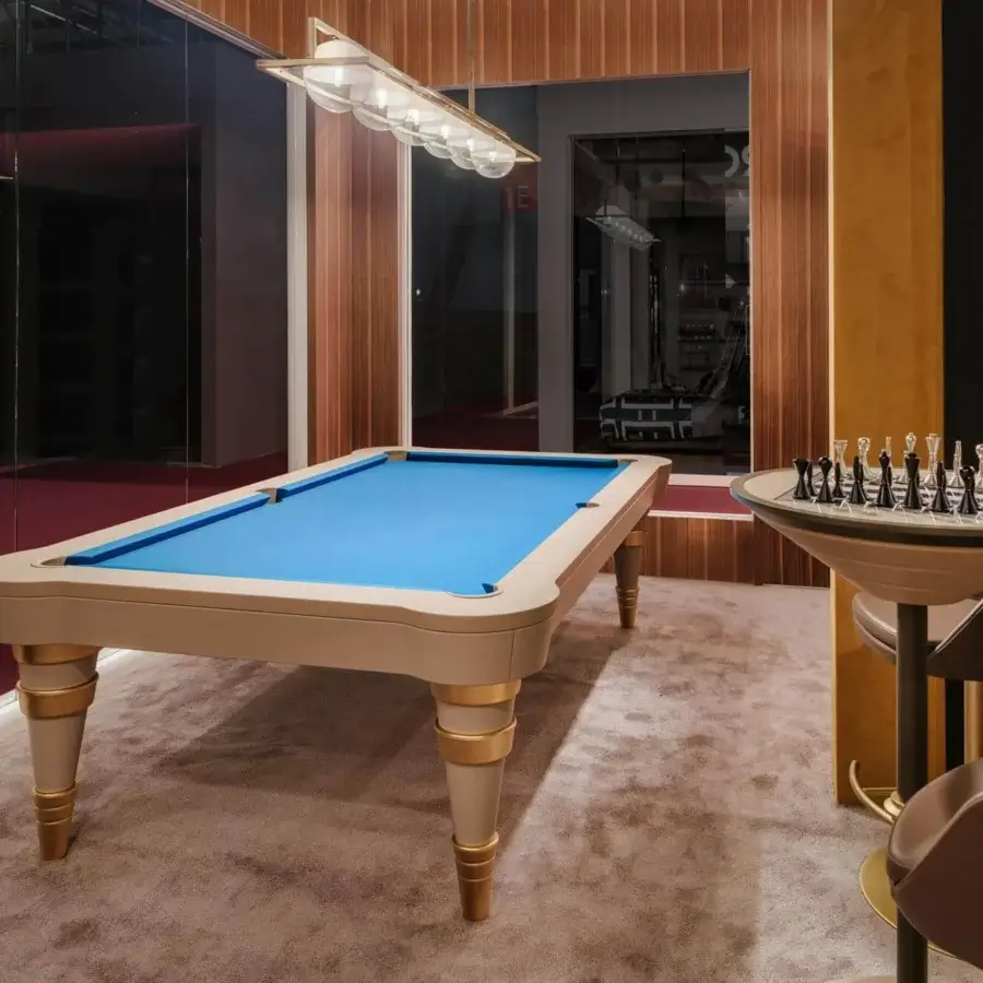 Exclusive Vismara Regis pool table built with slate, bright blue Simonis cloth, lacquered wood, gold-plated steel and European leather accents