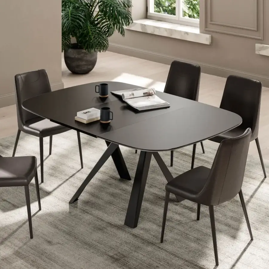 Distinguished Ozzio Italia Bombo table with rounded square anti-fingerprint glass and intersecting painted metal legs in a dark matte finish