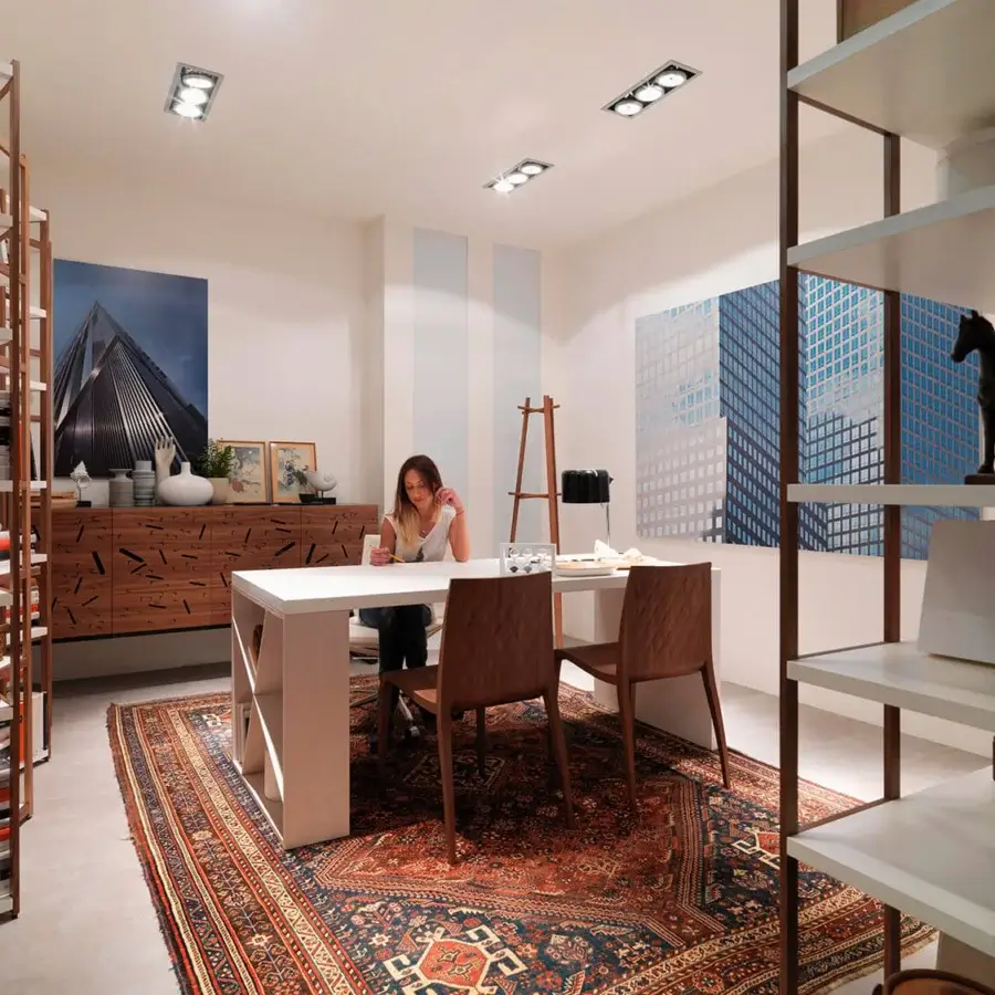 Superior Horm Singles bookcase with a solid walnut frame and fixed lacquered MDF shelves in contrasting white