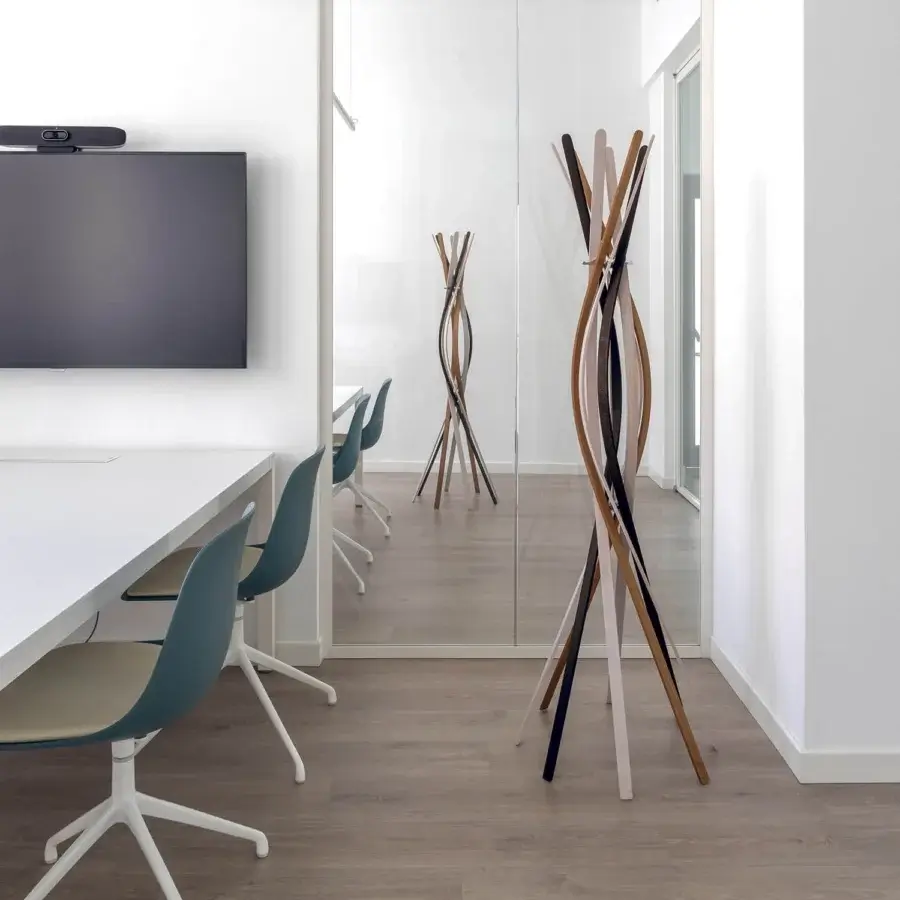Innovative Horm Twist coat stand crafted in beechwood with twisting slats displaying varied tones of black, brown and beige