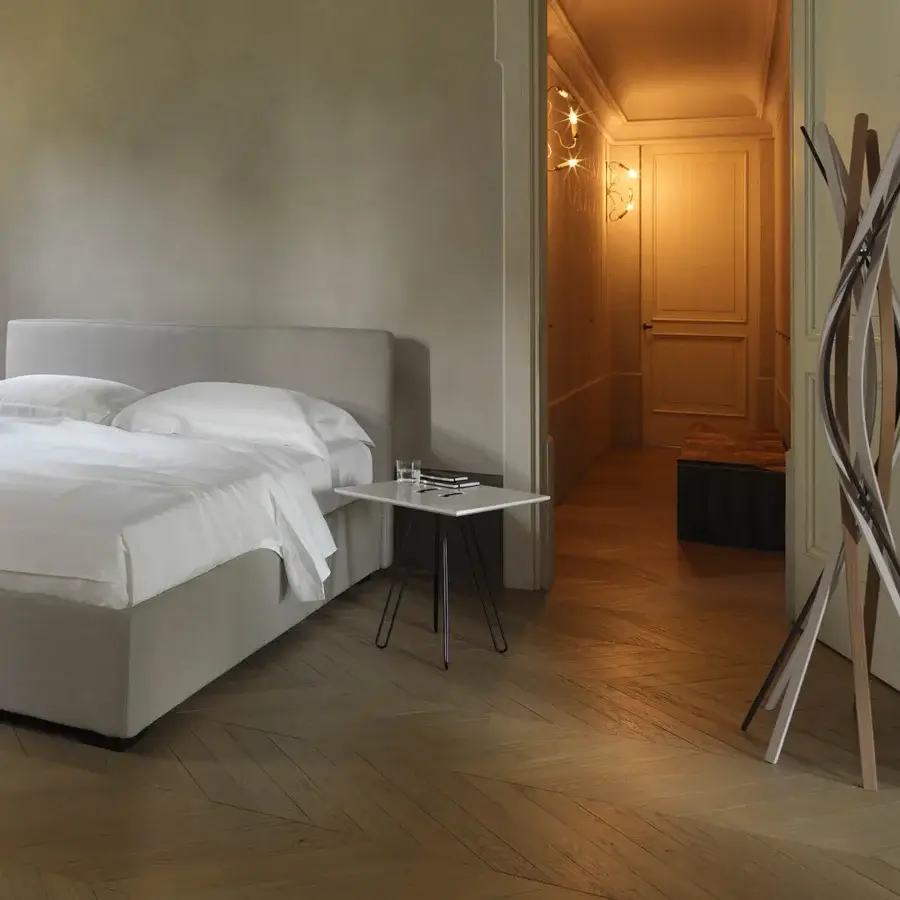 Exceptional Horm Twist coat stand crafted in beechwood with bending slats displaying natural wood tones and black finish