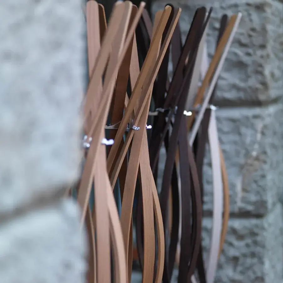 Luxury Horm Twist coat stand crafted in twisting beech slats displaying varying shades of light and dark brown wood