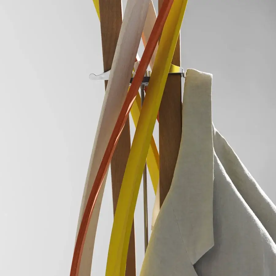 Captivating Horm Twist coat stand built with twisting beech slats displaying yellow, orange, and brown hues with clear hooks