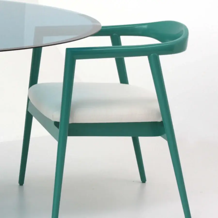 Refined Casa Casati Romy armchair with natural ash wood legs and glossy green lacquer, built with a comfortable white textile seat