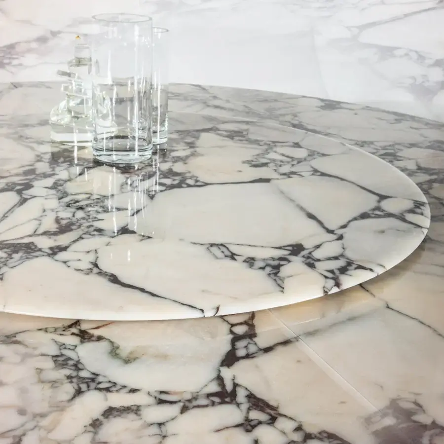 Exceptional Casa Casati Discoteca table crafted with veined marble and light bronze finished brass legs
