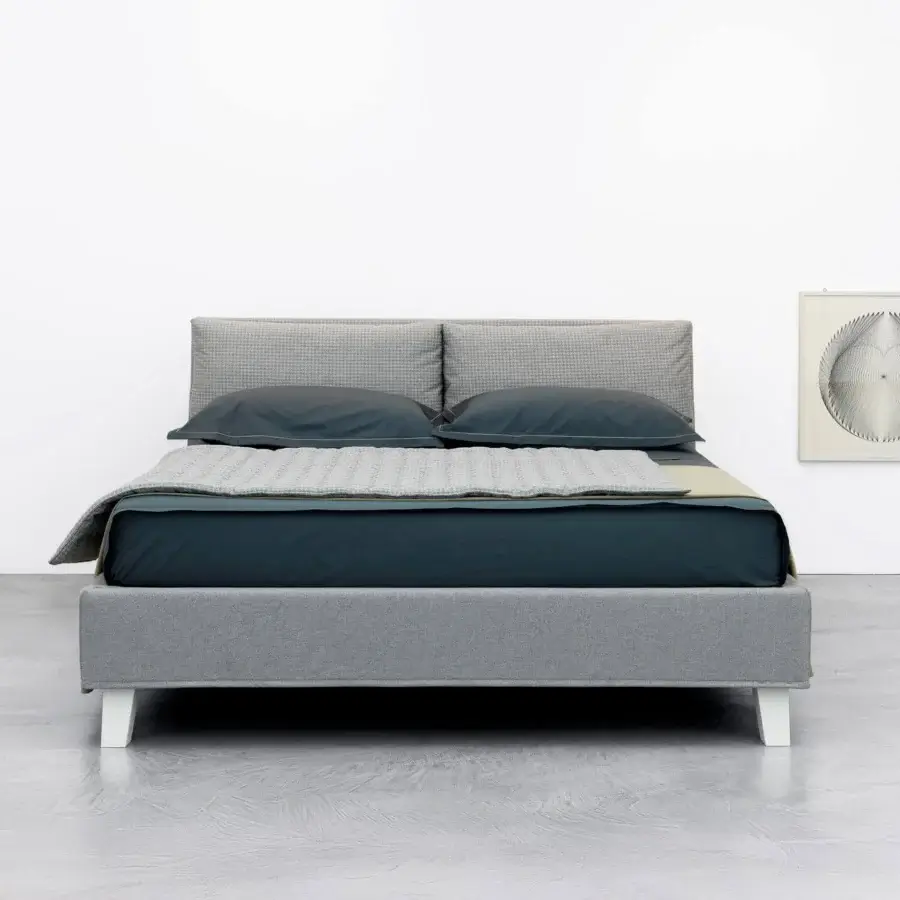 Distinguished Horm Bahamas bed with light gray textile upholstery and white lacquered solid beechwood legs