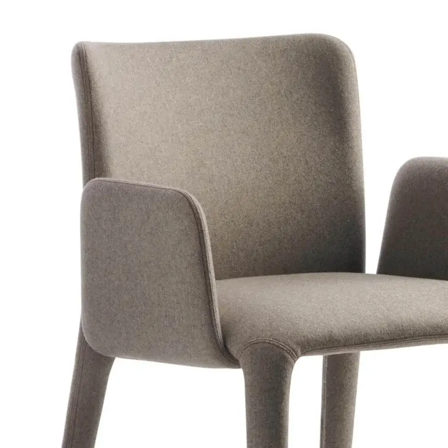 Distinctive Potocco Lars armchair with sinuous legs fully upholstered in soft matte gray textile exhibiting a geometric silhouette
