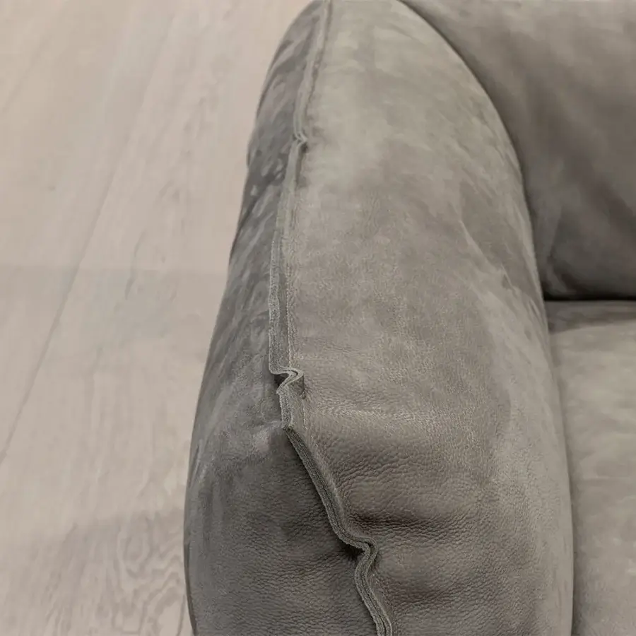 Superior Cierre1972 Up-Down sectional in calming gray textile with matte finish and raw-cut edges exhibiting curved lines
