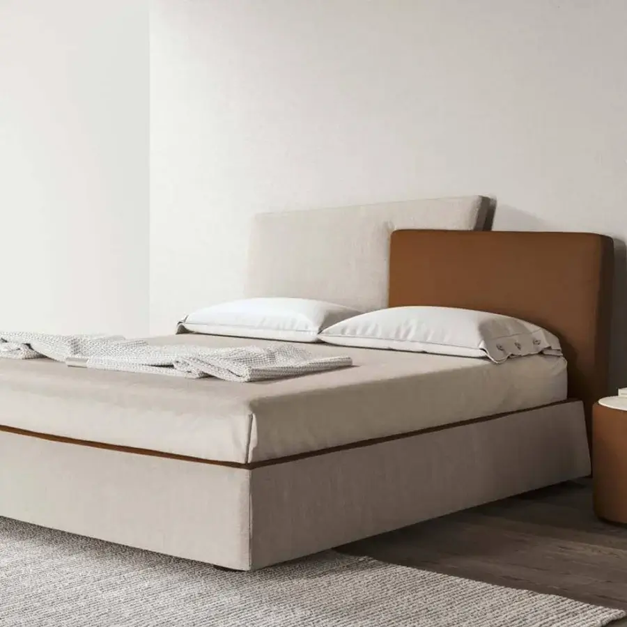 Harmonious Presotto Meeting Up bed with low profile silhouette upholstered in light beige fabric and contrasting brown trapezoidal accent