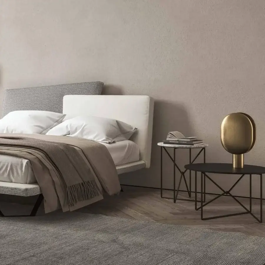 Distinguished Presotto Meeting bed with a deconstructed headboard upholstered in light gray and white textiles and dark metal legs