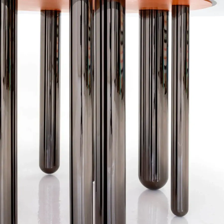 Exceptional Casa Casati Discoteca table with transparent glass top and irregularly spaced black nickel legs crafted in fumé glass