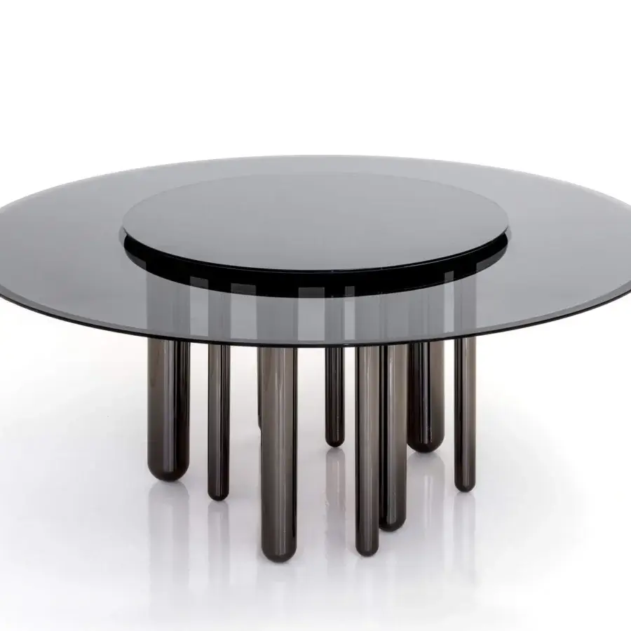 Distinguished Casa Casati Discoteca table with fumé glass top, mirrored Lazy Susan and irregularly spaced black nickel legs in a glossy finish