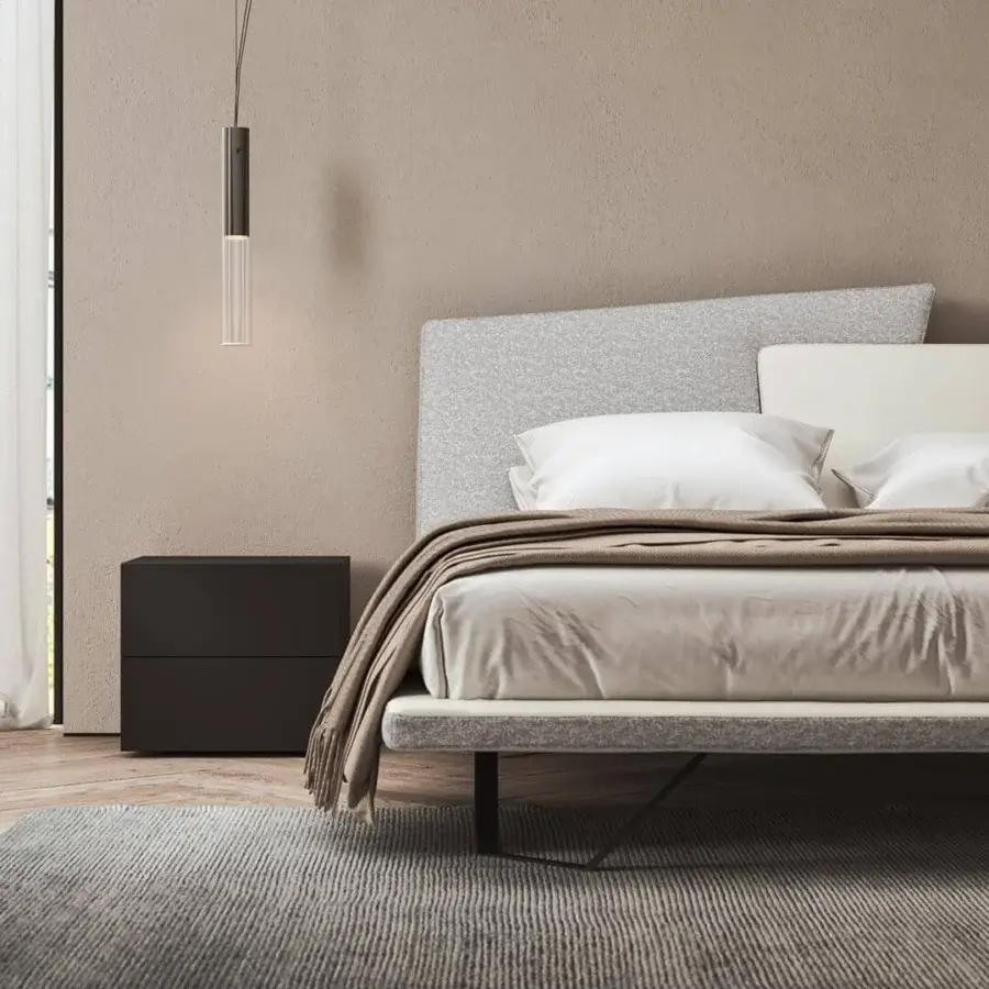Harmonious Presotto Meeting bed with a deconstructed headboard upholstered in light grey textile and dark metal sledge base