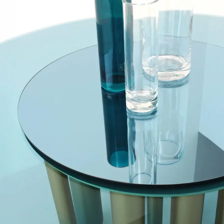 Exceptional Casa Casati Discoteca table with blue glass top, mirrored Lazy Susan and irregularly spaced turquoise and gold brass legs