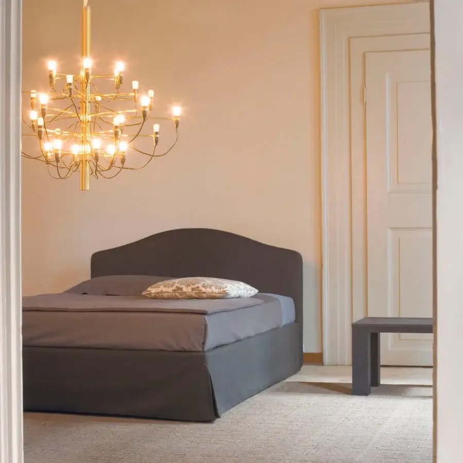 Superior Horm Elba Plus bed with dark gray textile covering and mocha lacquered solid beechwood feet