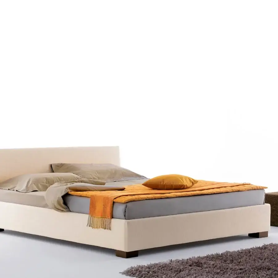 Distinguished Horm Figi bed with light beige textile upholstery and solid beechwood feet in mocha lacquer finish